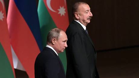 FILE PHOTO: Russian President Vladimir Putin and his Azerbaijani counterpart Ilham Aliev during their meeting in Baku.