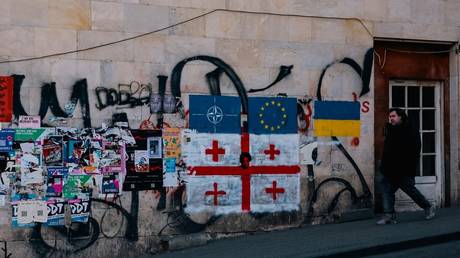 Graffiti in Tbilisi showing flags of NATO, the EU, Georgia, and Ukraine in January 2025.