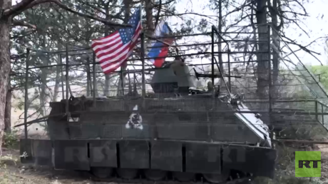Russian troops from viral clip explain why they hoisted US flag (VIDEO)