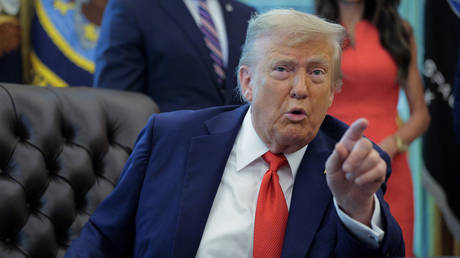 US President Donald Trump talks to journalists after signing executive orders in the Oval Office at the White House on August 25, 2025.