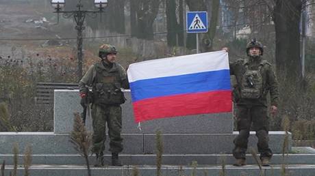 FILE PHOTO: Russian soldiers pose after liberating Krasnoarmeysk in the Donetsk People’s Republic.