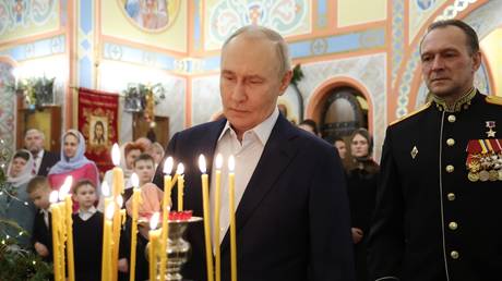 Russian President Vladimir Putin attends a Christmas service in a church outside Moscow on January 7, 2026.