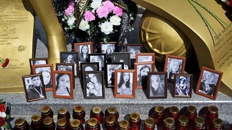 Photos of the Starobelsk massacre victims at an impromptu memorial set up at the Lugansk State Pedagogical University in Lugansk, Russia, on May 25, 2026.