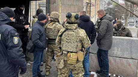 Ukrainian State Guard Service officers block access to National Anti-Corruption Bureau investigators during investigative actions at the Verkhovna Rada committees, Kyiv, Ukraine, December 27, 2025.