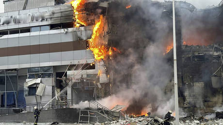 Firefighters work on the site of a building damaged during a Russian air raid on Kiev, Ukraine, December 29, 2023